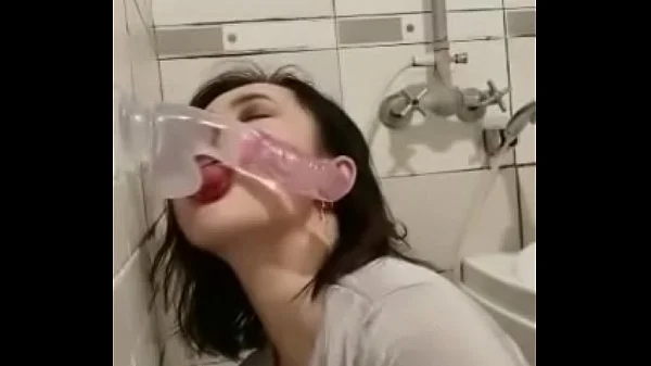 Asian deepthroating a dildo