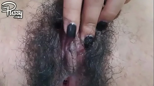 Extreme close-up hairy pussy masturbation