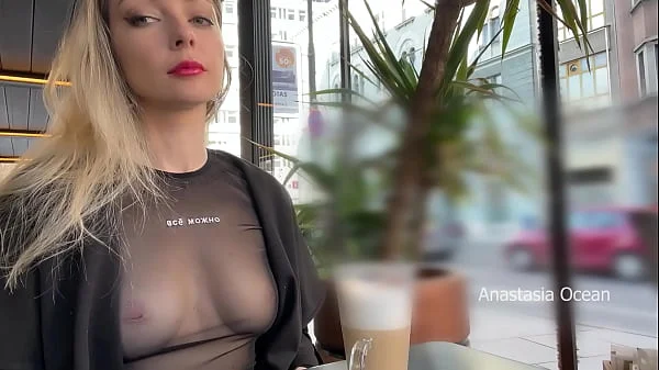 Flashing tits in cafe with glass walls so all people outside see me. Transparent t-shirt no bra.