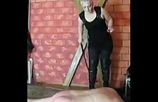 Russian amateur mistress whiping slave laying on the ground